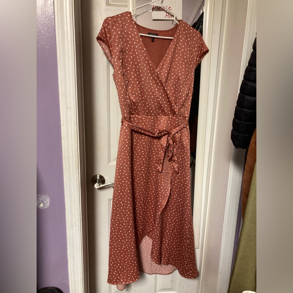 Polka-dot V-neck dress with wrap tie.